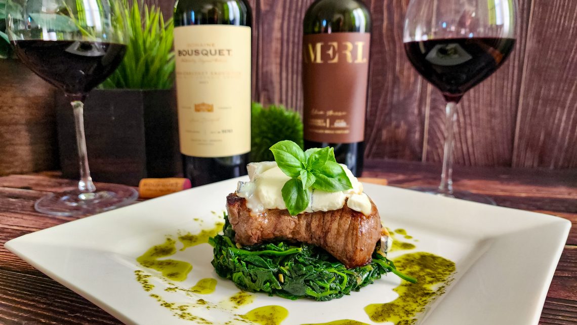 Domaine Bousquet Cabernets with Spinach and Sirloin Steak topped with Humboldt Fog cheese and garnished with basil oil